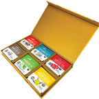 The Herbal Goodness Variety Tea Gift Set features 24 organic teabags in six flavors—moringa, chamomile, ginger, hibiscus, tulsi, and mullein—neatly arranged in a yellow open box showing each colorful packet.