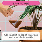 A hand pours Flourish Organic All-Purpose Plant Food, mixed with 8oz of water, into a potted plant. Instructions advise feeding indoor plants weekly. Visible: pink tiles, a green leafy plant, and the Flourish brand on the packet.