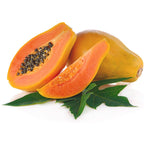 A whole and a cut Sunrise Papaya (Strawberry Papaya) - Carica by Wellspring Gardens reveal orange flesh and black seeds, arranged on green papaya leaves against a white background.