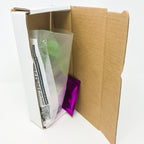 A Wellspring Gardens Cissus discolor Rex Begonia Vine, plastic-wrapped with a purple foil packet and folded instructions, is displayed in an open cardboard box against a plain white background.
